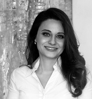 Headshot of Ahu Aydogan, smiling at the camera.