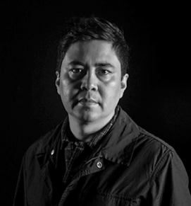 Headshot of Professor Frank Melendez, looking at the camera.